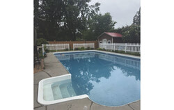 An inground pool, already enclosed by a six-foot fence and additional safety measures, still falls short of Quebec’s updated regulations—highlighting how even well-secured pools must meet new provincial standards by September 30. Photo: Courtesy