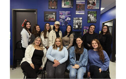 Kathy Lépine, coordinator at M-Ado Jeunes (beige shirt and tattoos) with her entire team (August 2025). Photo: Courtesy of Kathy Lépine