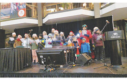 Performance by the choir during the Community Christmas Dinner at the Maison du Citoyen (December 24, 2024). Photo: Courtesy of La Soupe Populaire de Hull
