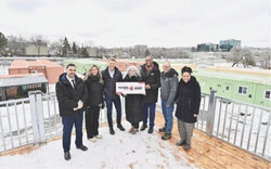 Federal officials and Gatineau's mayor gathered at the Village Transitiôn site on March 13 to announce $2.5 million in federal funding for the innovative transitional housing project. From left: Housing Minister Gregor Robertson, Hull-Aylmer MP Greg Fergus, and Gatineau Mayor Maude Marquis-Bissonnette. Photo: CNW Group/Canada Mortgage and Housing Corporation