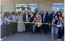 The general manager of the Centre en sécurité alimentaire de Gatineau, Marlène Goulet, cutting the ribbon, officially opening their new building. Photo: Jude Osmond