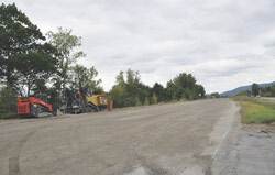 Heavy equipment sits idle on the side of Highway 148 after the government abruptly halted the project. 